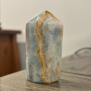 Polished Blue Onyx Point with rust colored natural bands